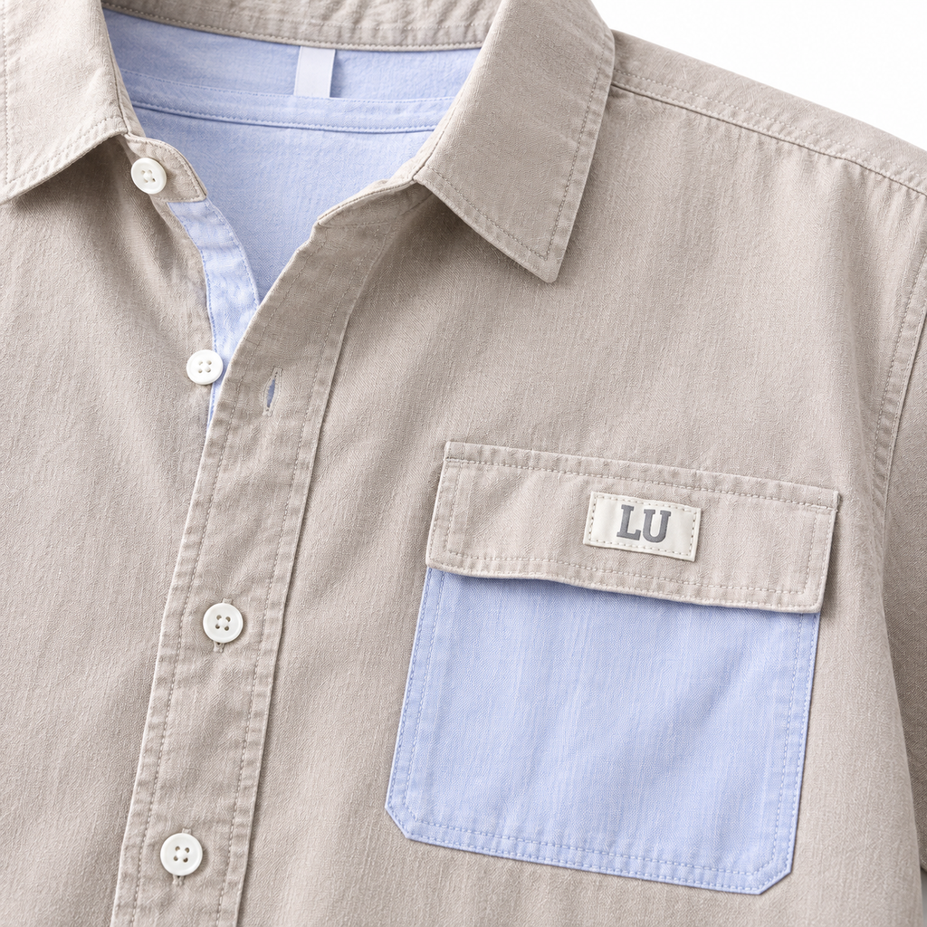 Beige men's casual button-down shirt detail.