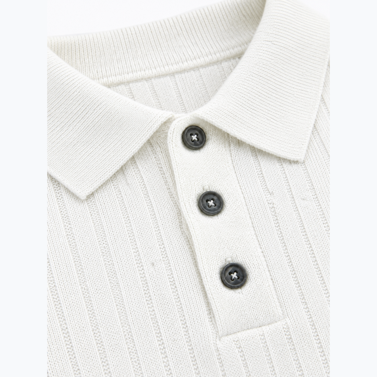 White men's ribbed sweater detail.
